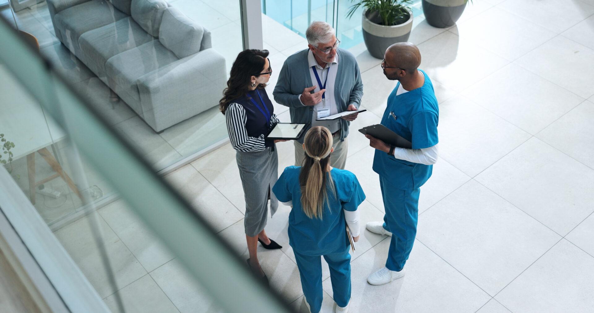 Doctors, medical team and tablet with discussion, advice and above for surgery or patient records. People, tech and nurse for professional opinion, help and results in healthcare, clinic or hospital Doctors, medical team and tablet with discussion, advice and above for surgery or patient records. People, tech and nurse for professional opinion, help and results in healthcare, clinic or hospital